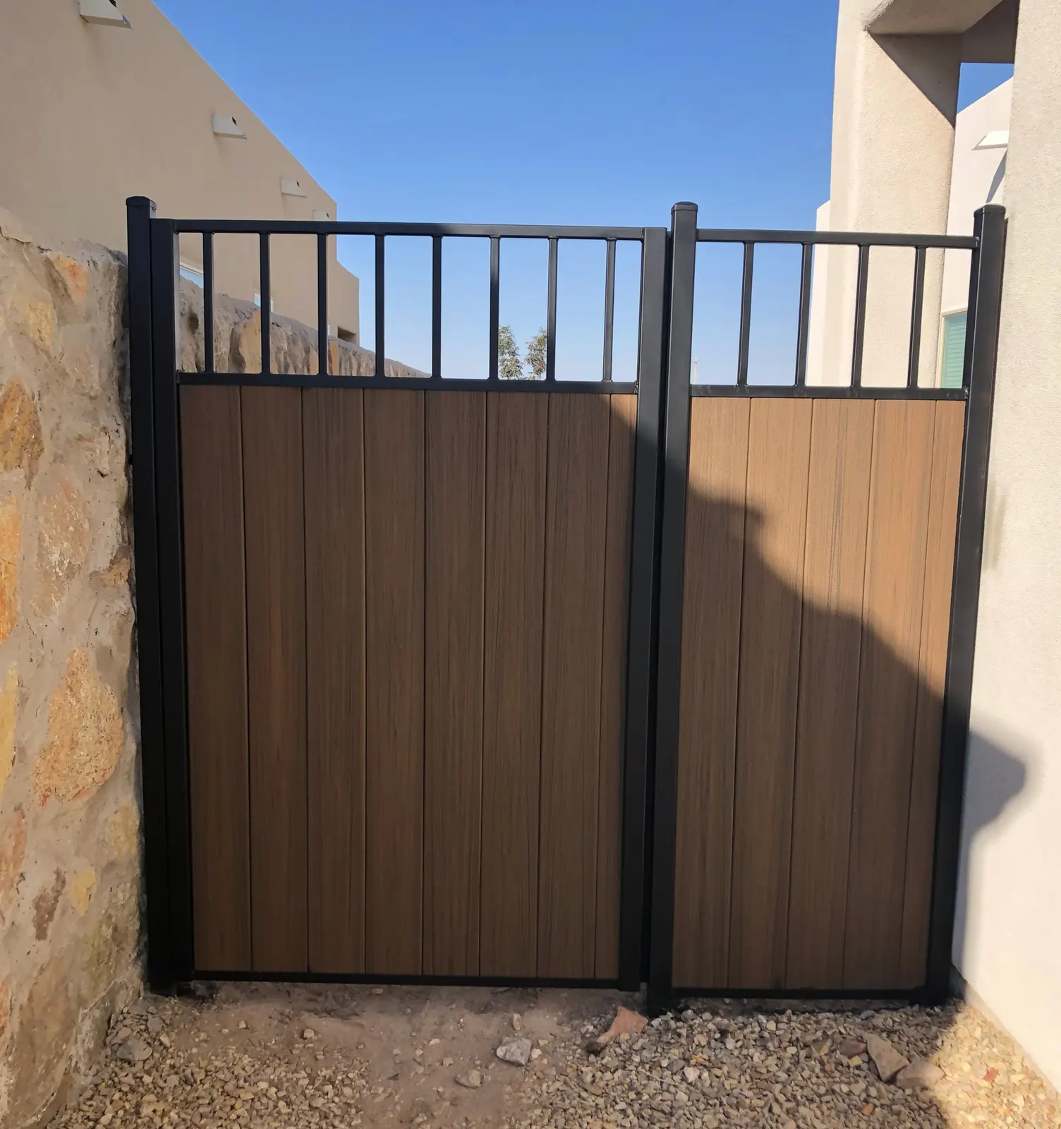 Steel-frame side gate with wood-look composite privacy panels